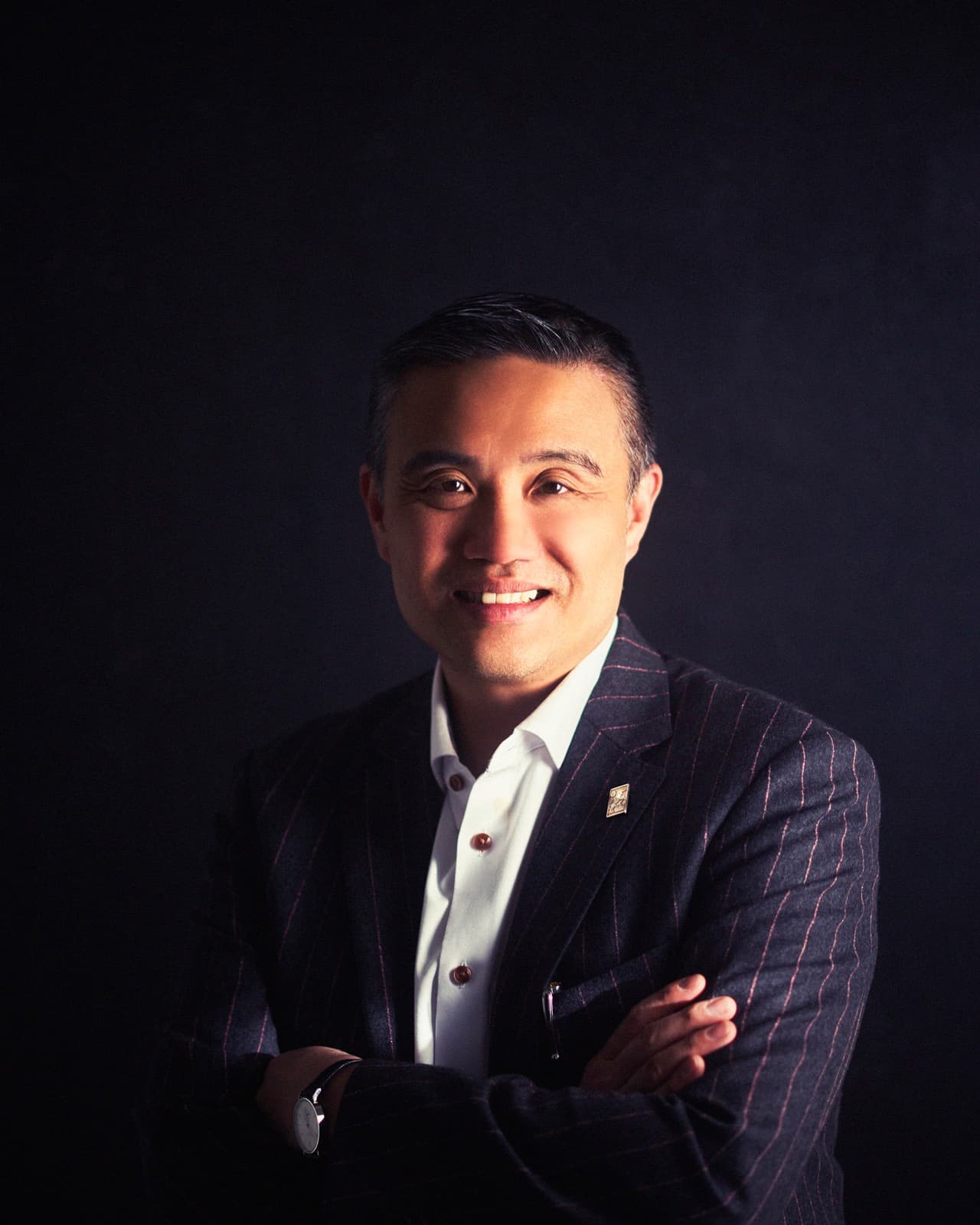 Professor Paul Lee in a pinstripe suit, photographed for the Brainz Magazine cover feature