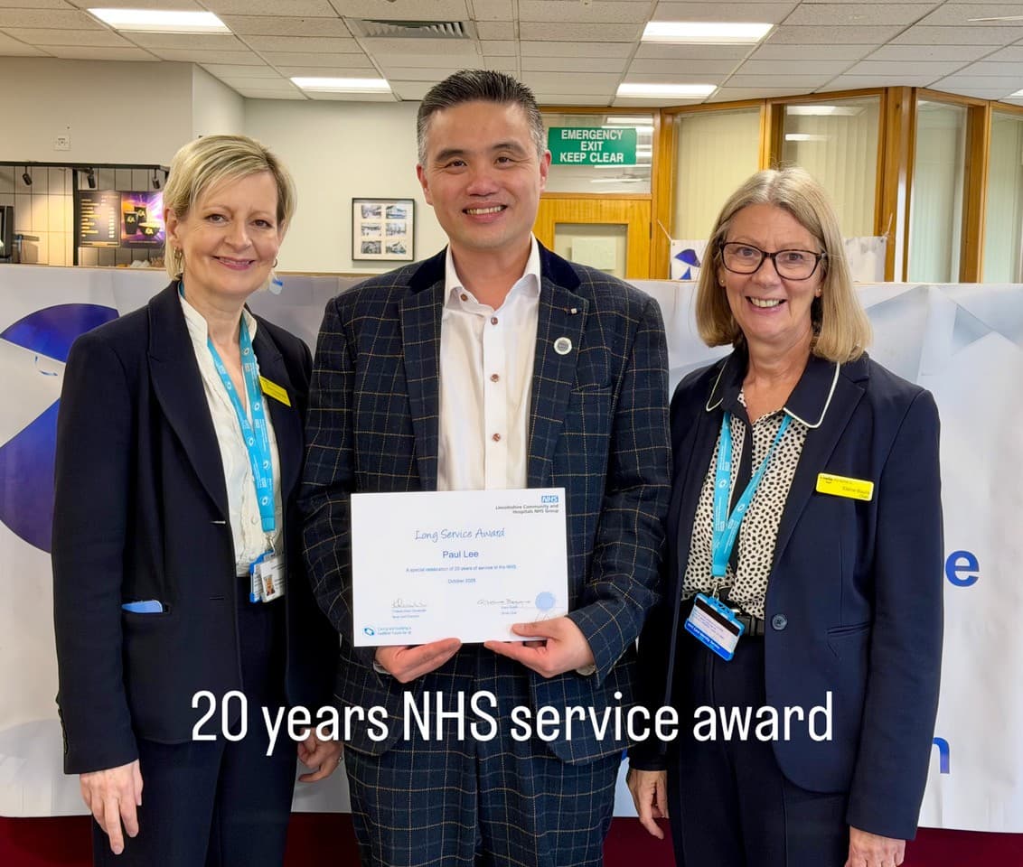 Professor Paul Lee receiving the NHS 20 Years Long Service Award